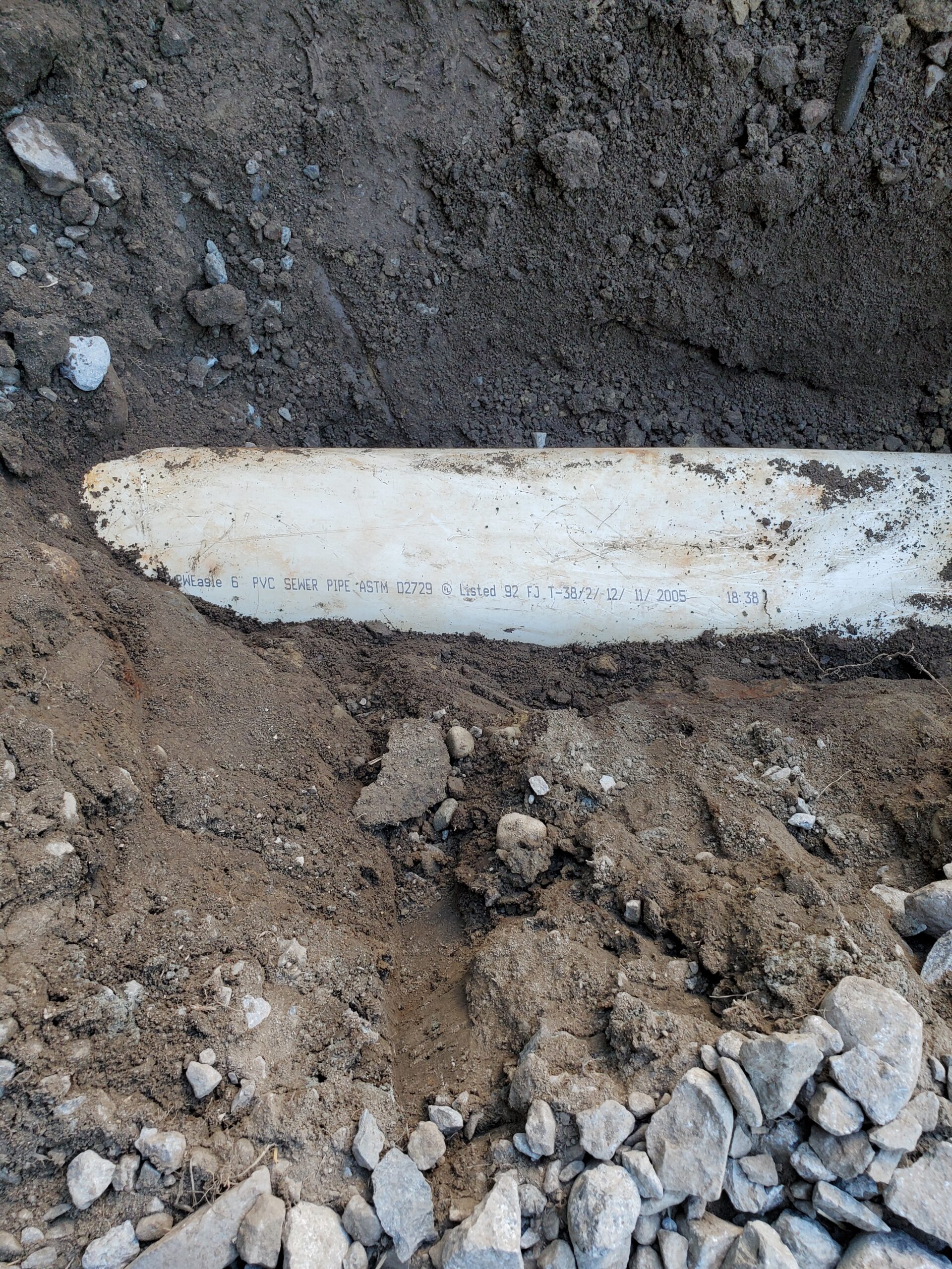 6" drain pipe flattened by heavy construction traffic.  Fixed.