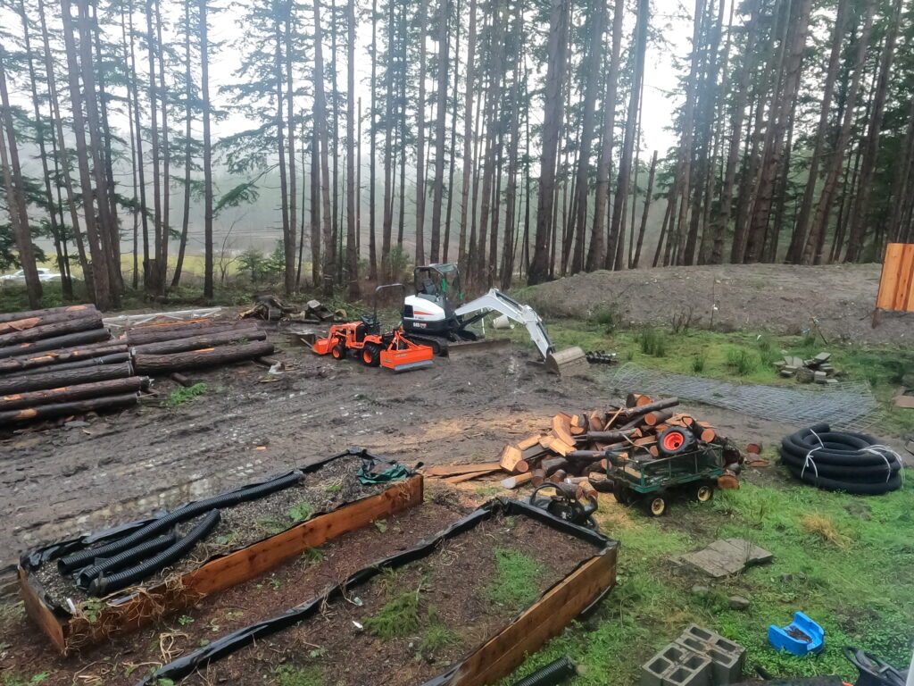 Residential excavation chainsaw milling log stacking garden boxes