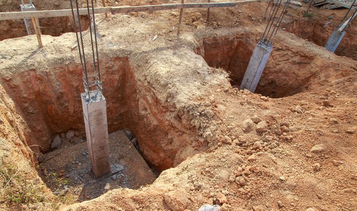 excavated post holes of a house foundation